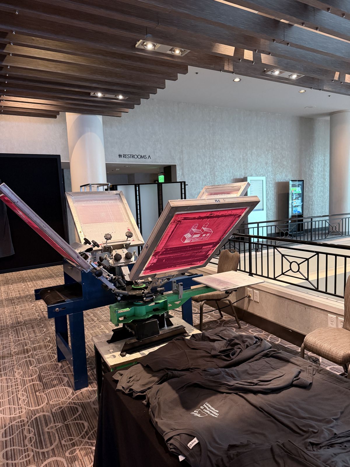 Merch Troop live printing — fresh prints off the platen